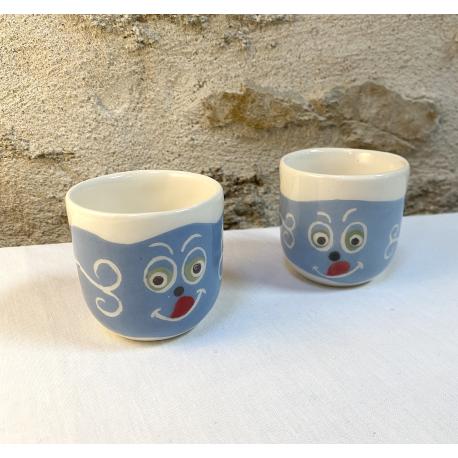 Petite tasse visage gourmand bleu et blanc Petite tasse visage gourmand bleu et blanc